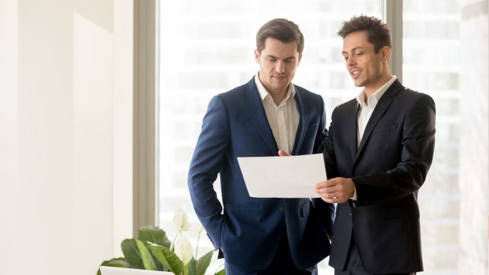 Two Professionals Reviewing Documents Together